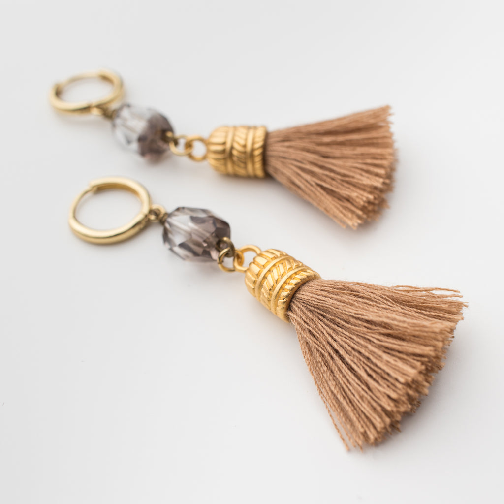 Muted taupe tassel with a sparkly crystal quartz  on a mini hoop, matching style earrings. 
