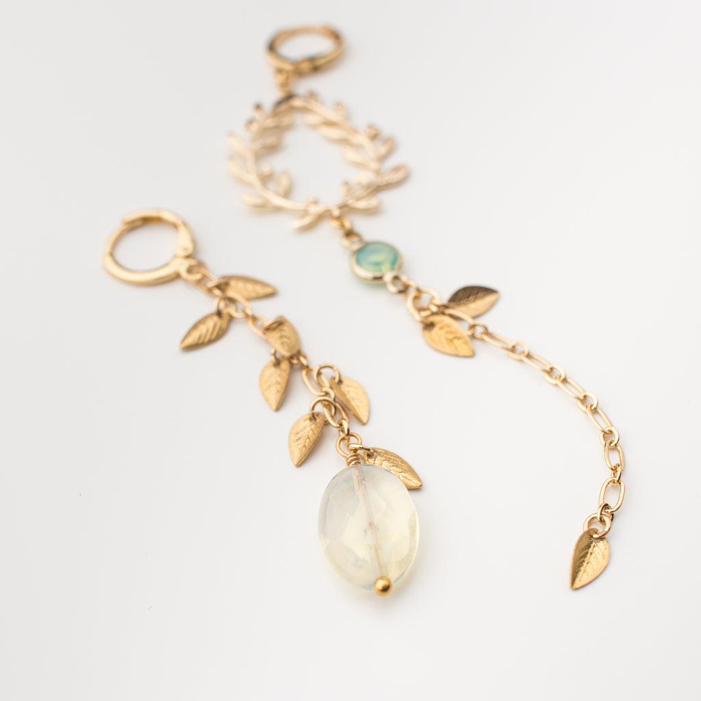 Gold vine leaves with chalcedony and upcycled gemstones earrings in a mismatched style. 