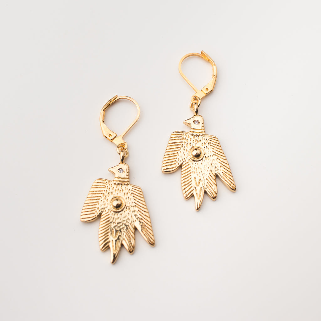Gold birds with a zircon eye earrings in a matching style.