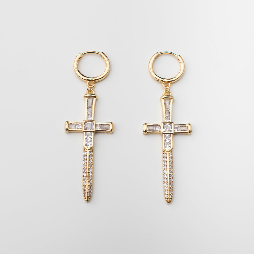 Gold sword earrings with zircon in a matching style