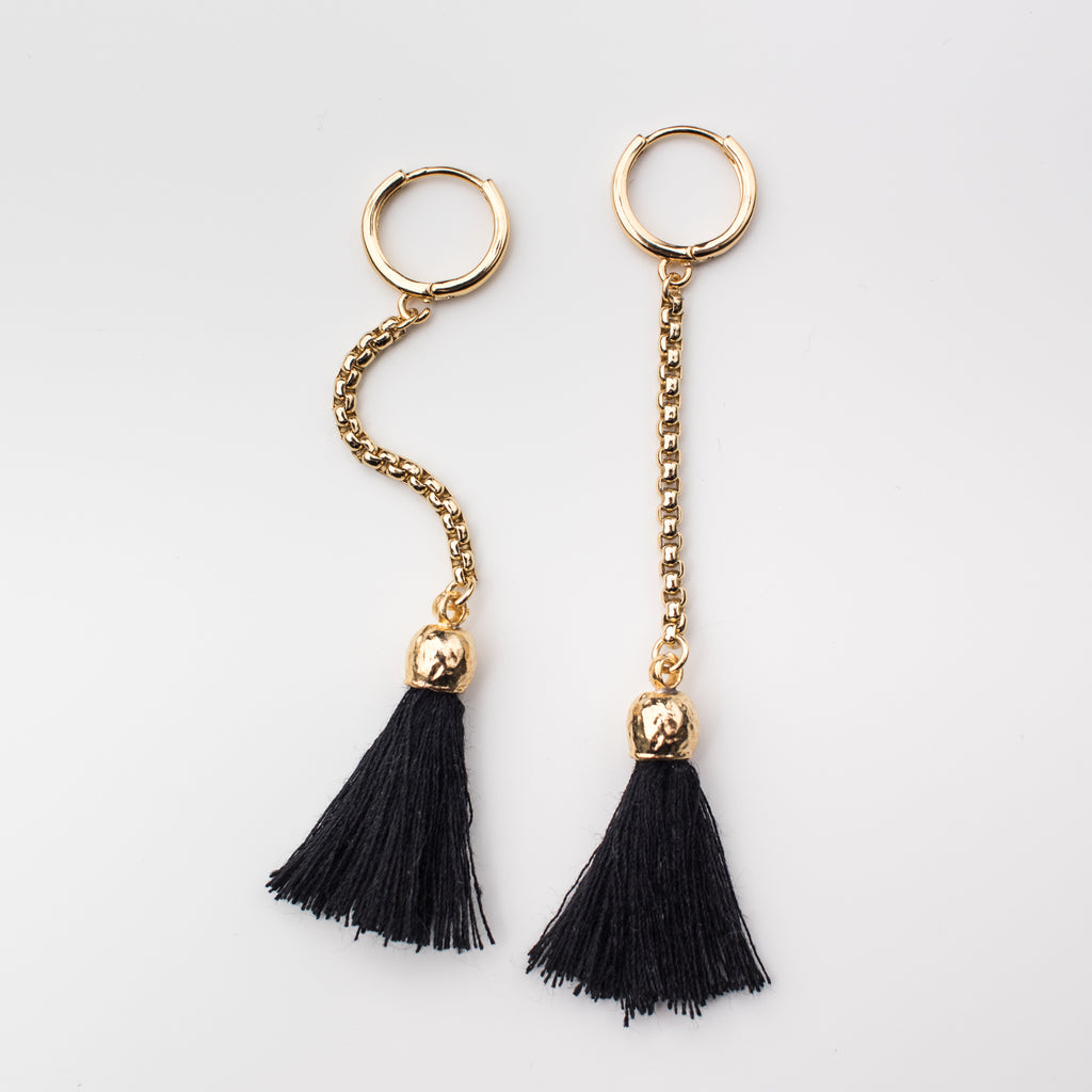 Black tassel with a gold chain on a mini hoop, matching style earrings. 