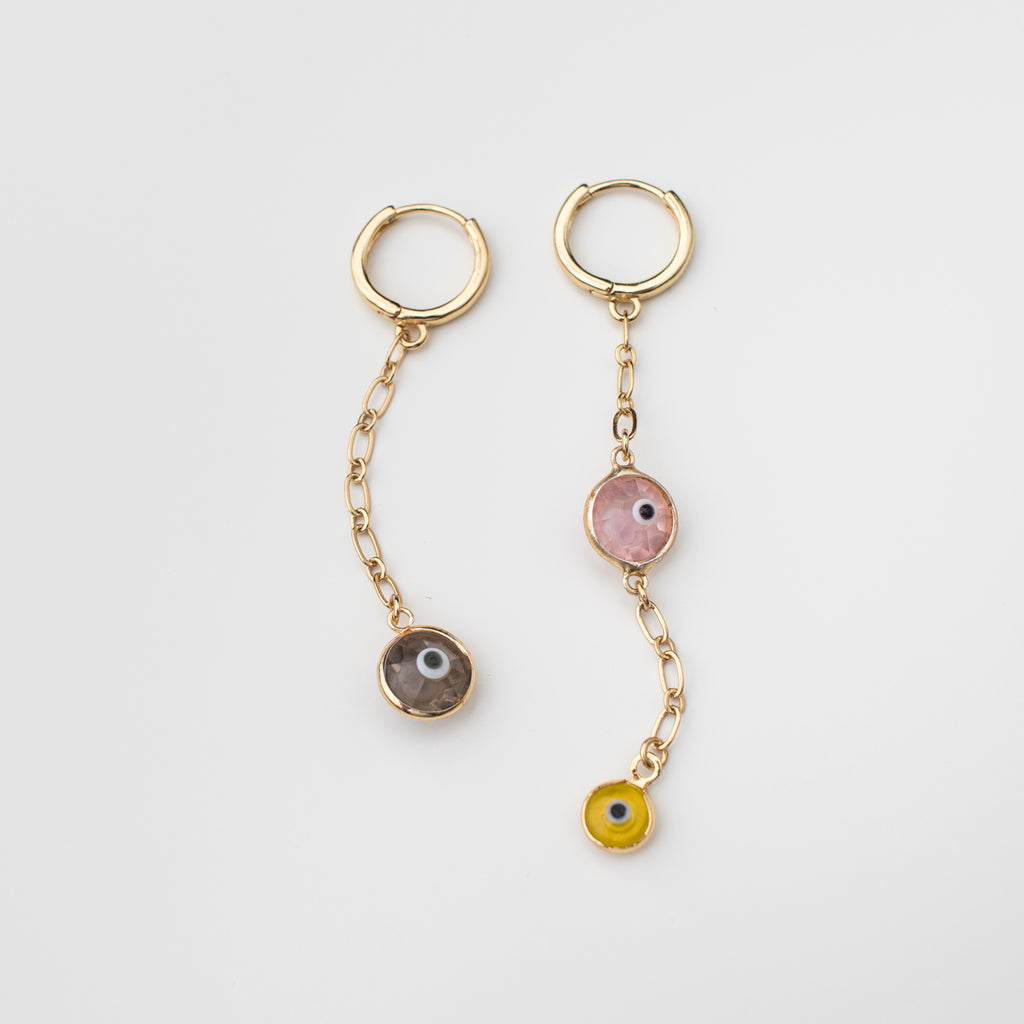 Gold mini hoop earrings with light pink, taupe & yellow crystal eye charms.
