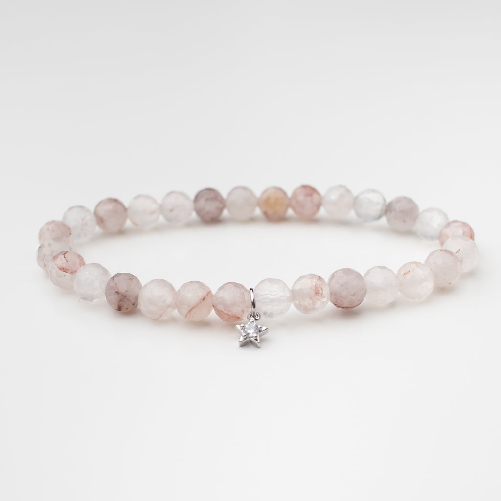 Cherry quartz stretchy bracelet with silver sparkly star.