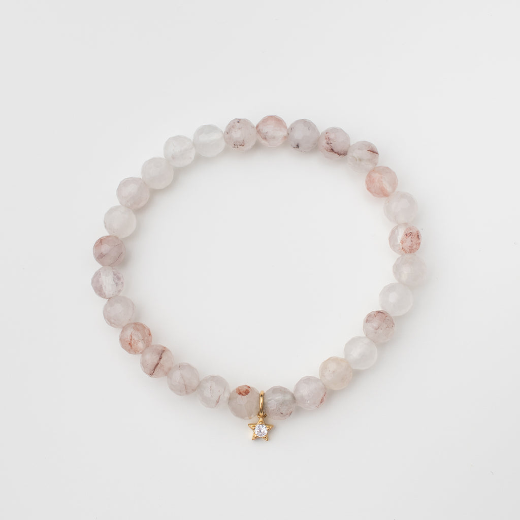 Cherry quartz stretchy bracelet with gold filled sparkly star.