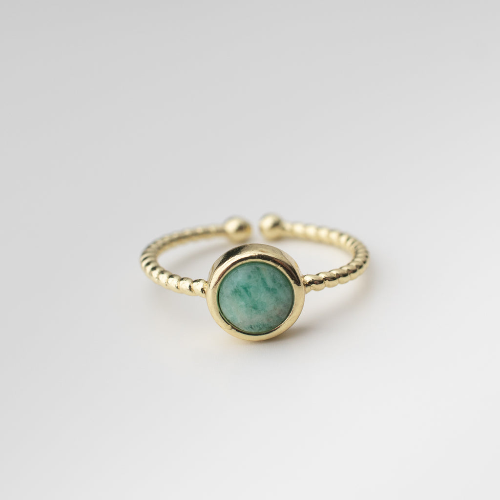 Gold twisted adjustable friendship ring with a green teal gemstone agate centre. 