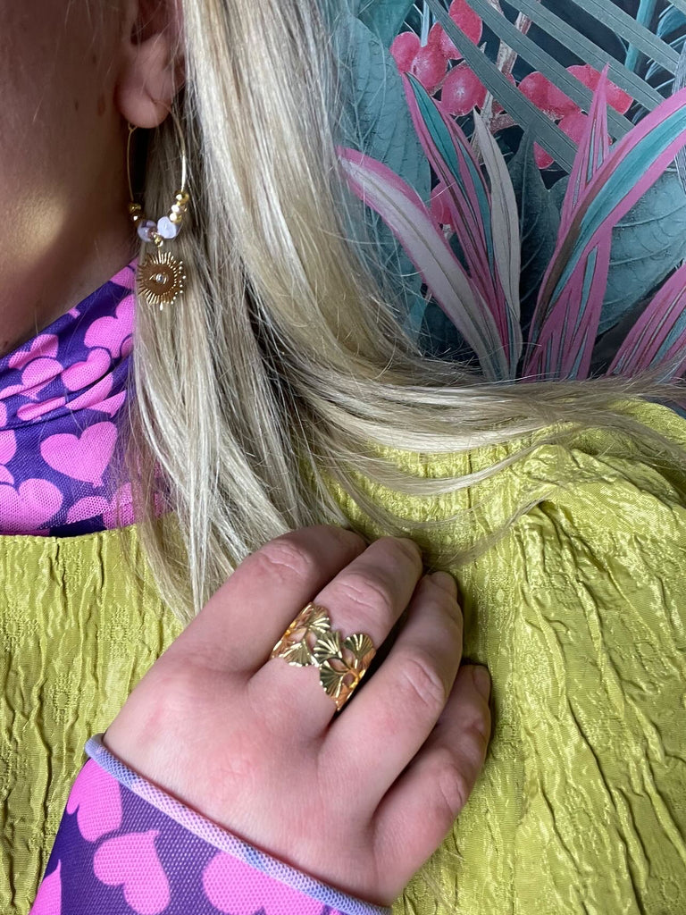 Model Eliza wears Gold Leaf Ring, adjustable in size.