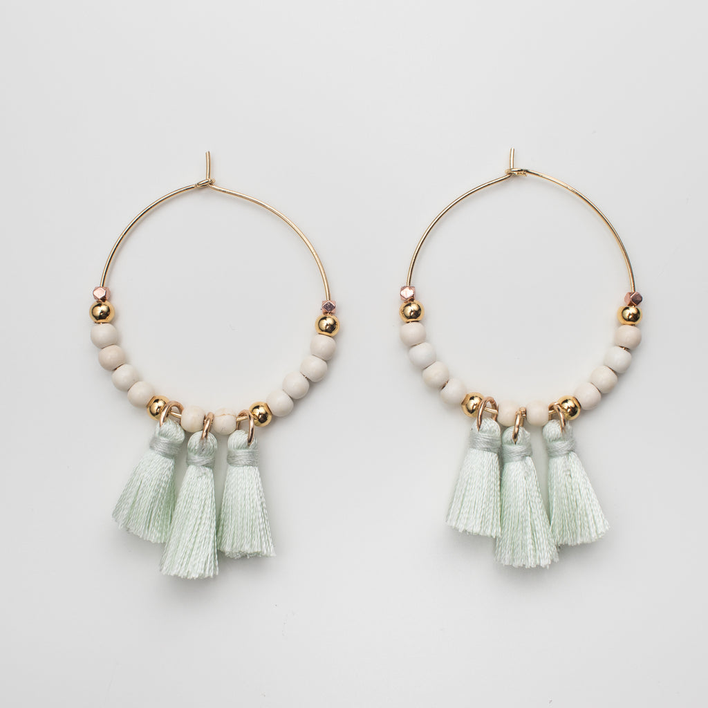 Green tassel hoop earrings with cream magnesite gemstones and gold beads in matching style