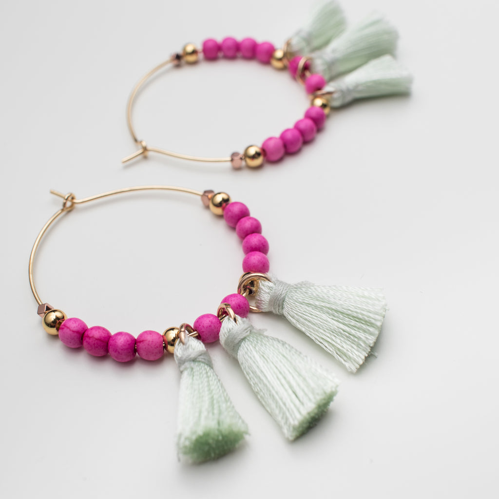 Green tassel hoop earrings with pink magnesite gemstones and gold beads in matching style