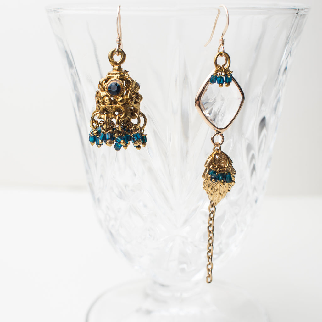 Gold Chandelier Earrings with teal, golden leaf and a clear crystal in a Mismatch upcycle Style