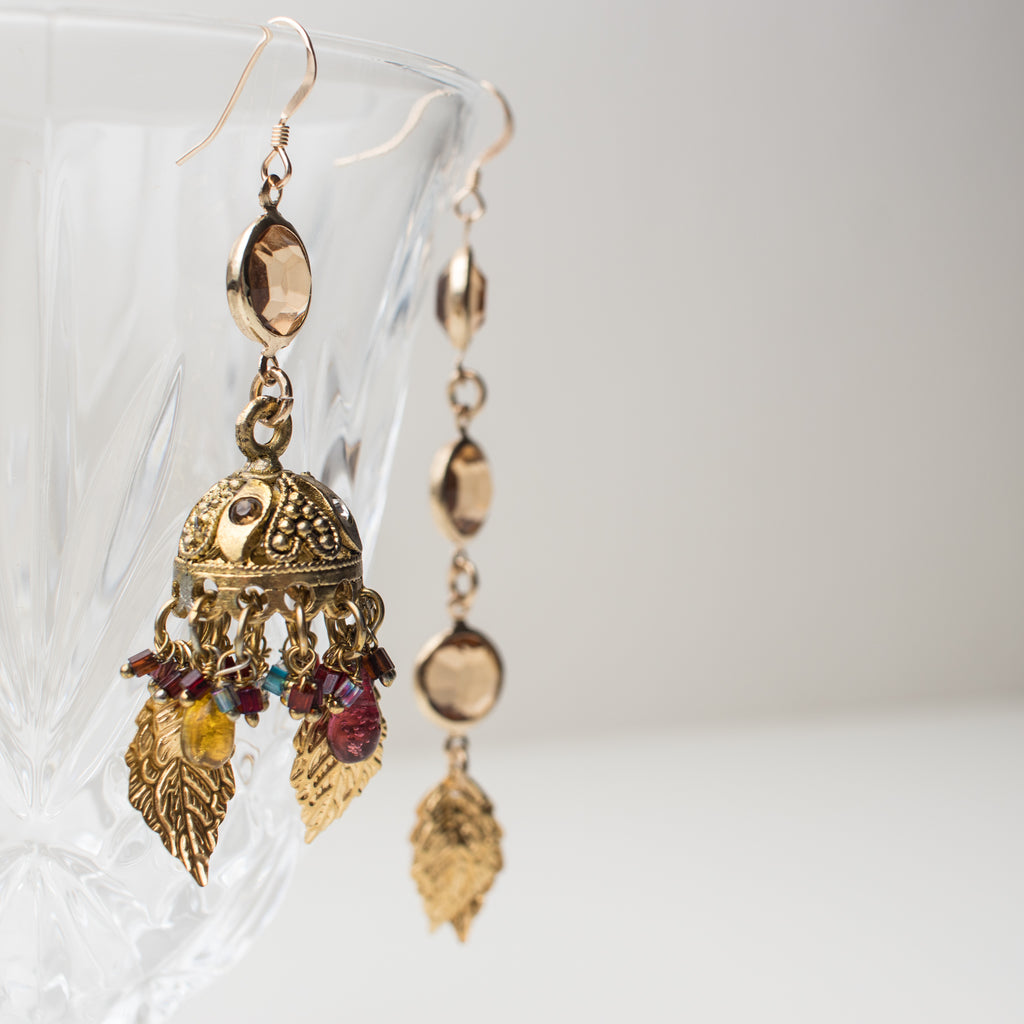Gold Chandelier Earrings with amber, golden leaves and multi coloured charms in a Mismatch upcycle Style