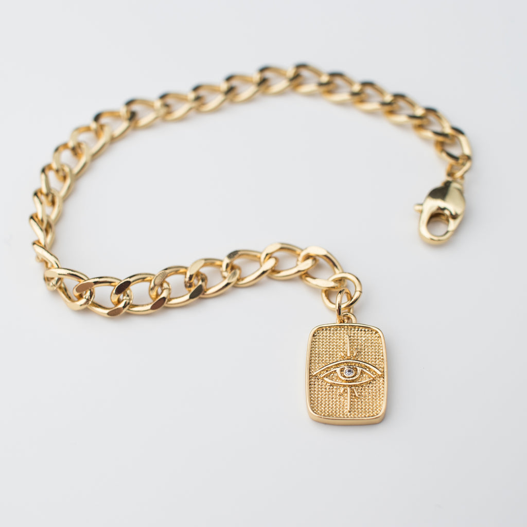 Gold chain bracelet with gold Egyptian eye tag
