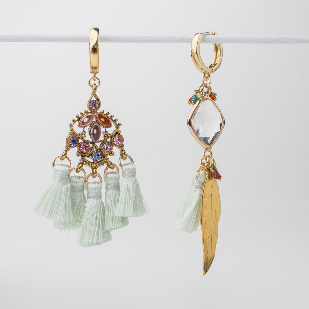 Gold green tassel hoop earring with gold feather and upcycled components in a mismatch style.