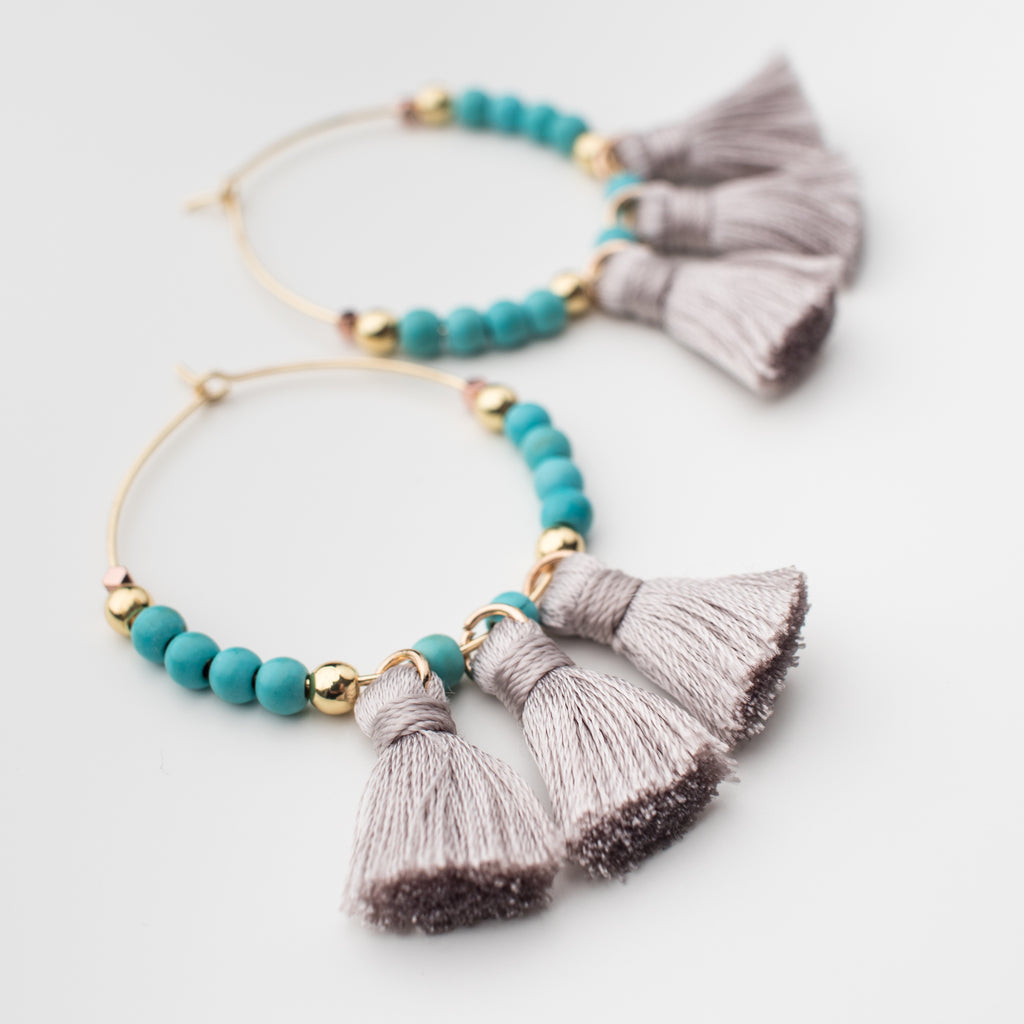 Grey tassel hoop earrings with turquoise  magnesite gemstones and gold beads in matching style