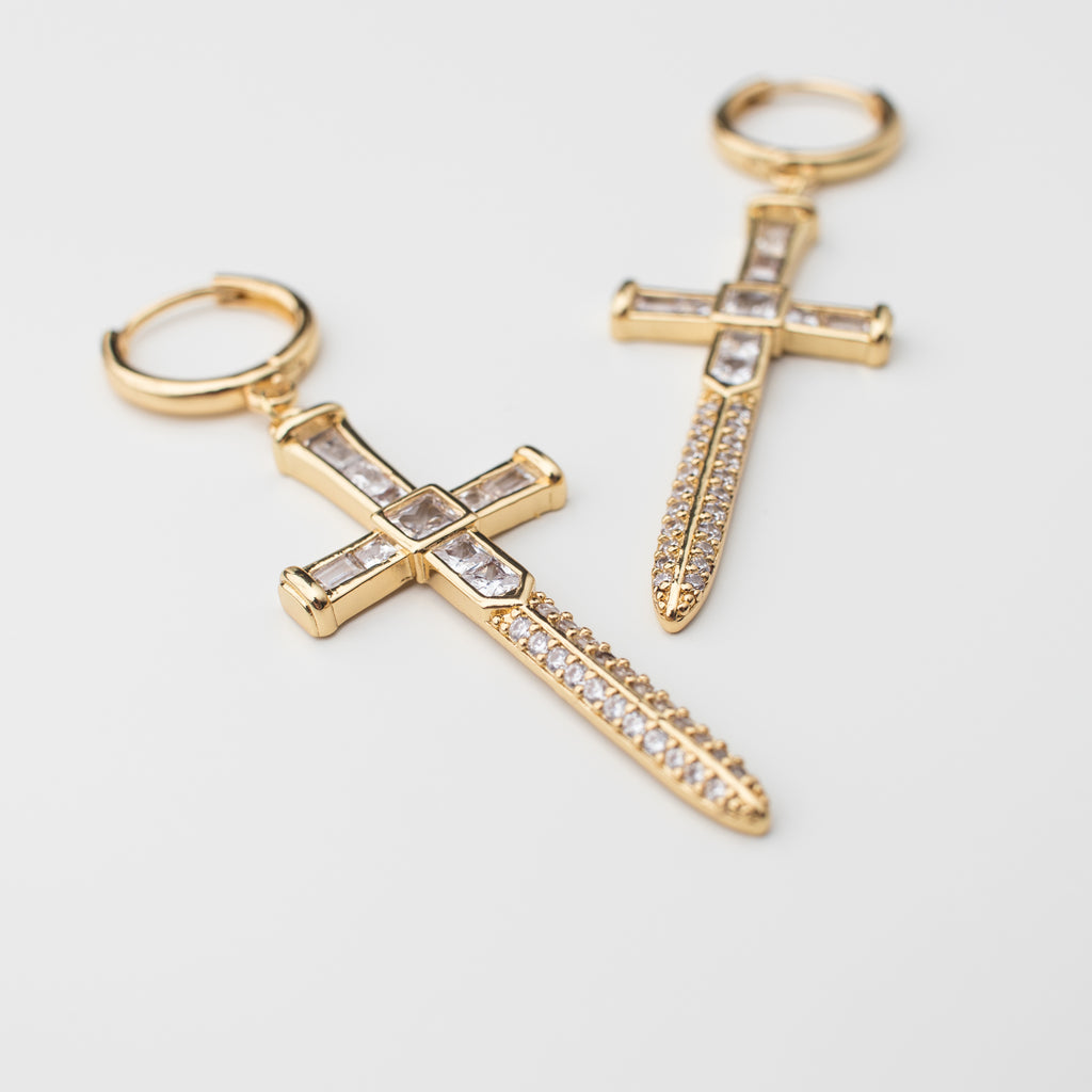 Gold sword earrings with zircon in a matching style