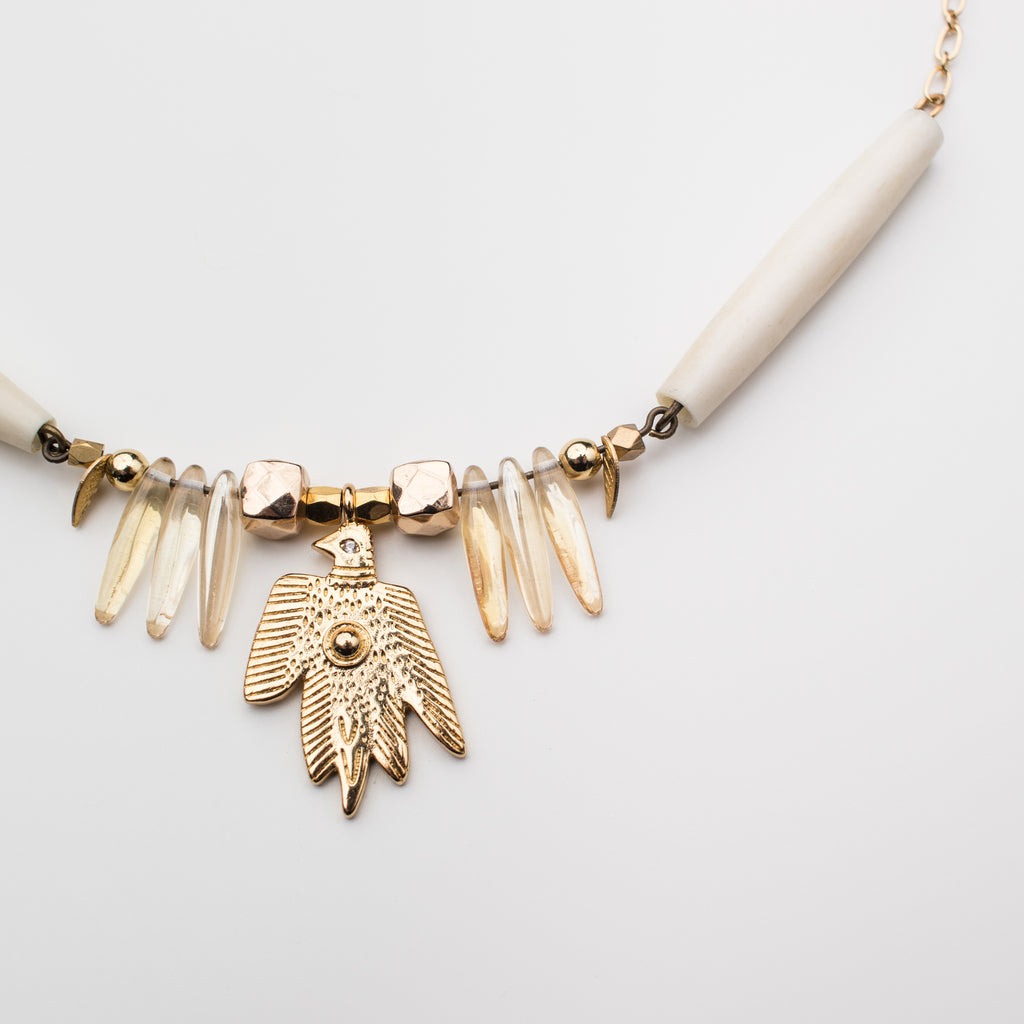 Sacred bird and cream bead necklace in a choker length.
