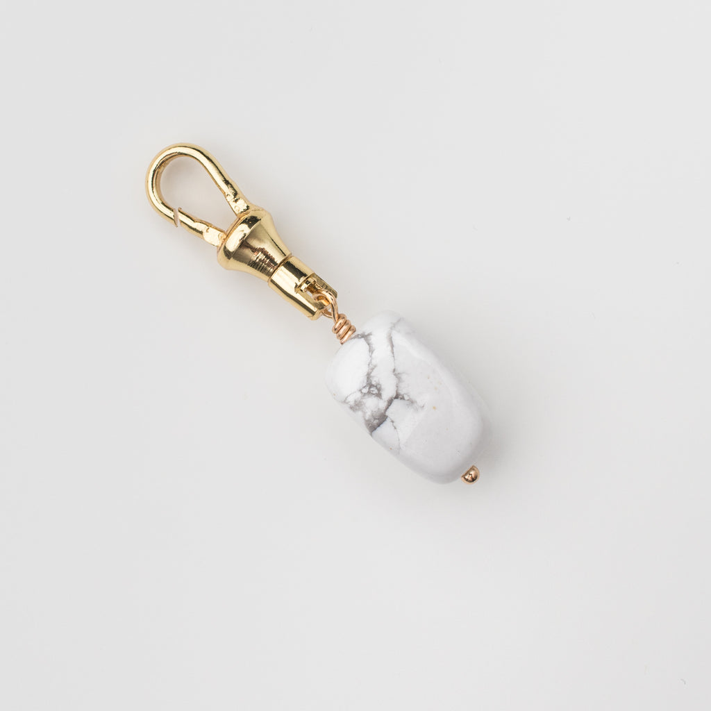 White howlite gemstone charm on a gold latch for a dog leash, dog collar, handbag, change purse, on the go lululemon bag and key chain. 