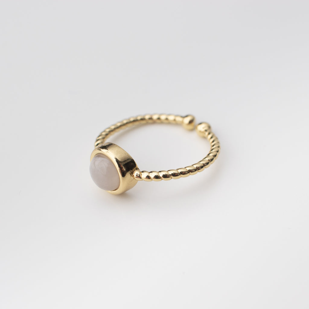 Gold twisted adjustable ring with a milky grey gemstone agate centre. 