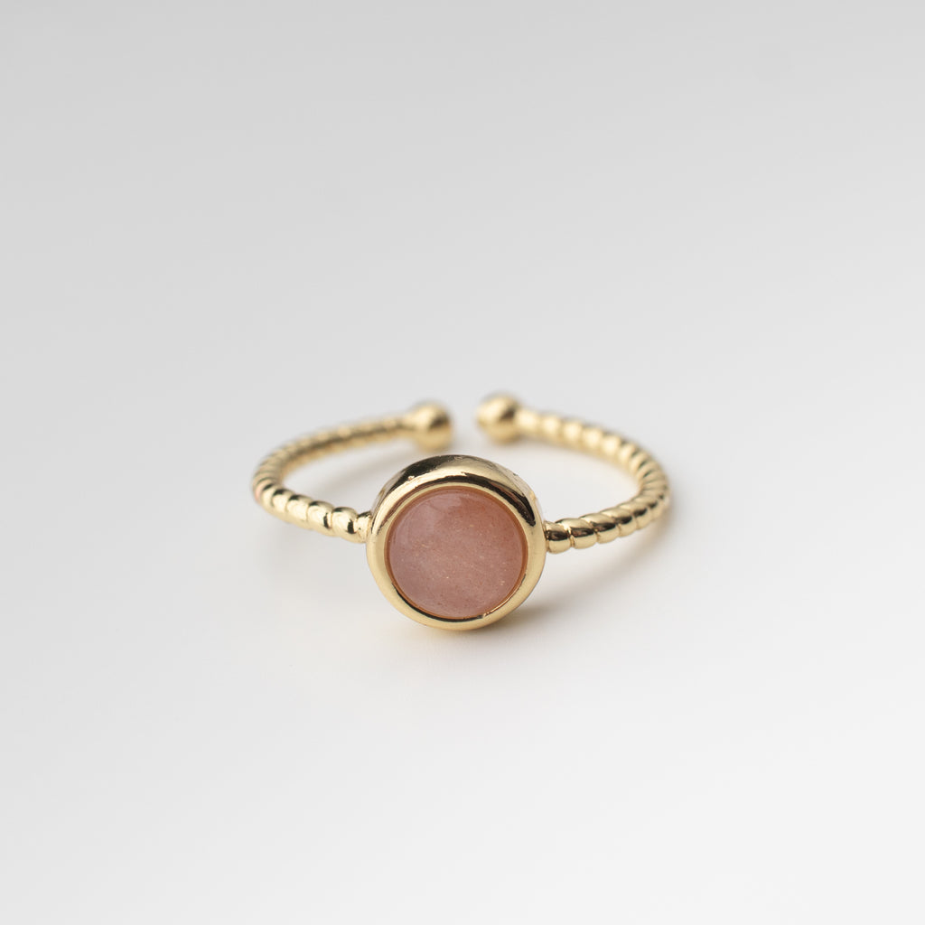 Gold twisted adjustable friendship ring with a blush rose gemstone agate centre. 